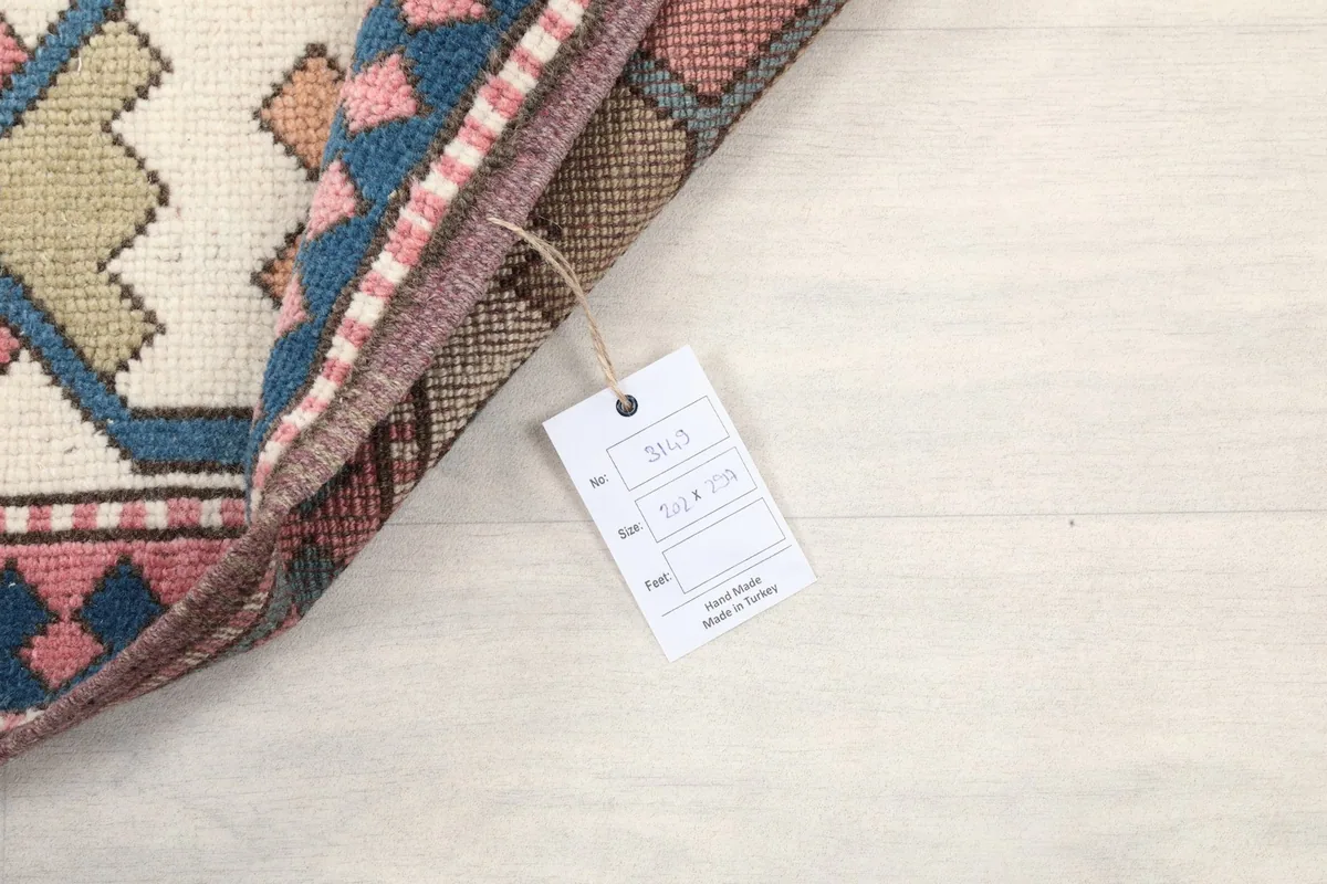 Rug corner with a product tag showing dimensions and origin details