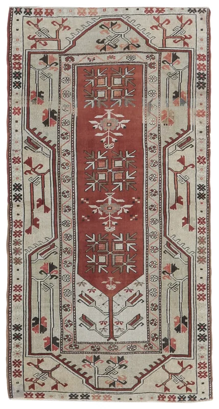 Full top view of a vintage rust and beige Anatolian rug on a white background