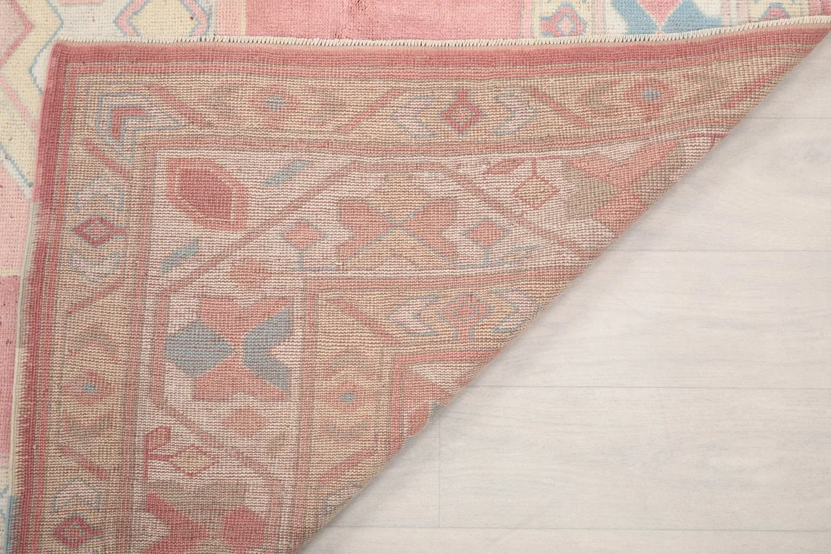 View of the rug's back and foundation, showing the hand-knotted construction