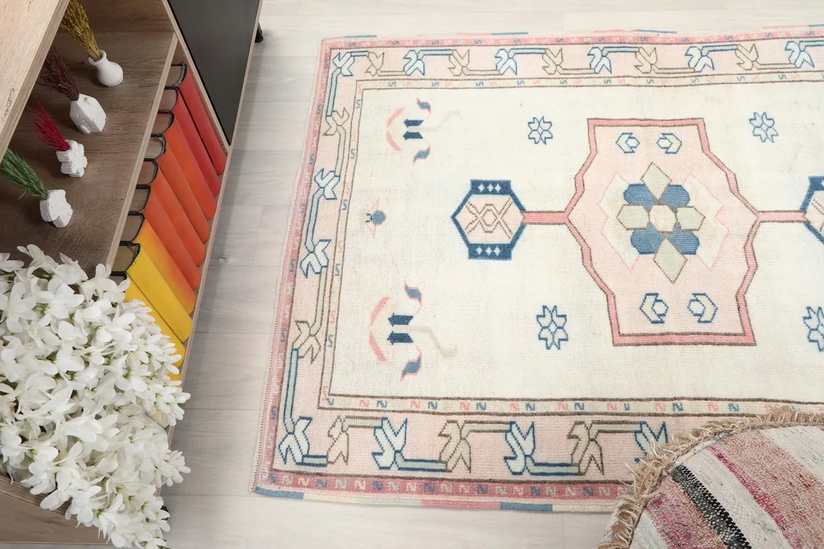 Top-down angle of the rug showing its full design and colors in a room setting