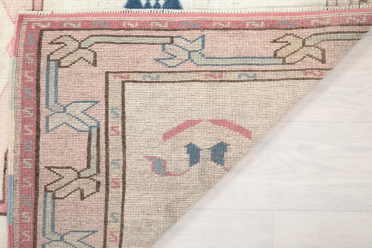 Another view of the rug's back, revealing the hand-knotted construction and foundation