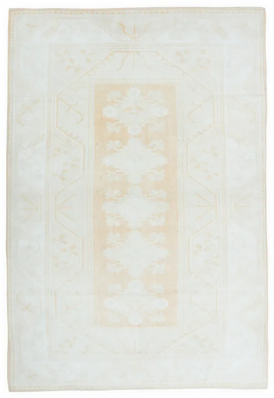 Full top view of the 6'5" x 9'7" ivory and beige floral geometric vintage Anatolian area rug.