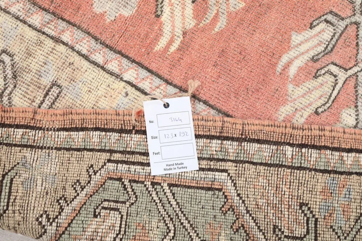 Product tag attached to the rug's corner, displaying its origin and material information