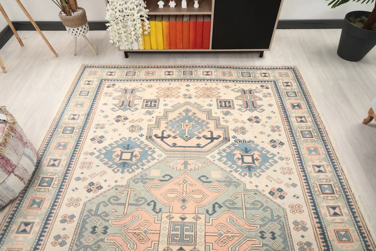 View of the large area rug from a different angle in the room, showcasing its full design.