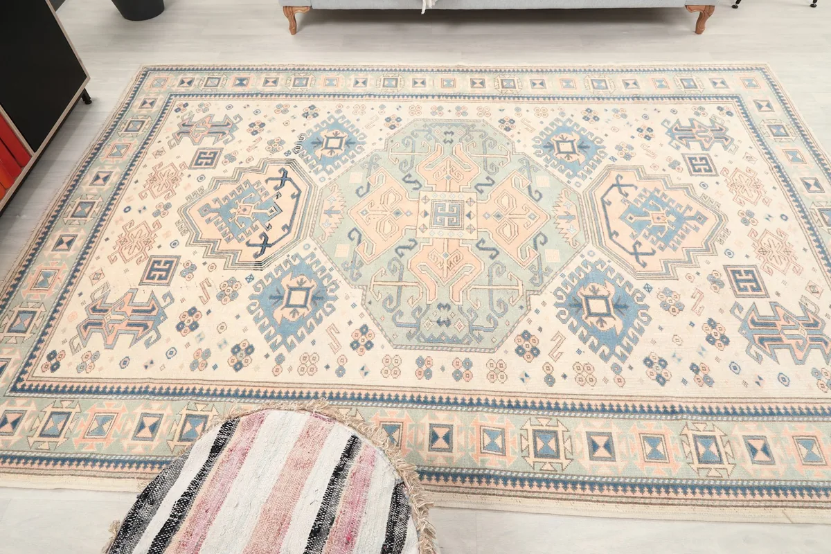 Overhead view of the rug laid out, emphasizing the symmetry and scale of the design.