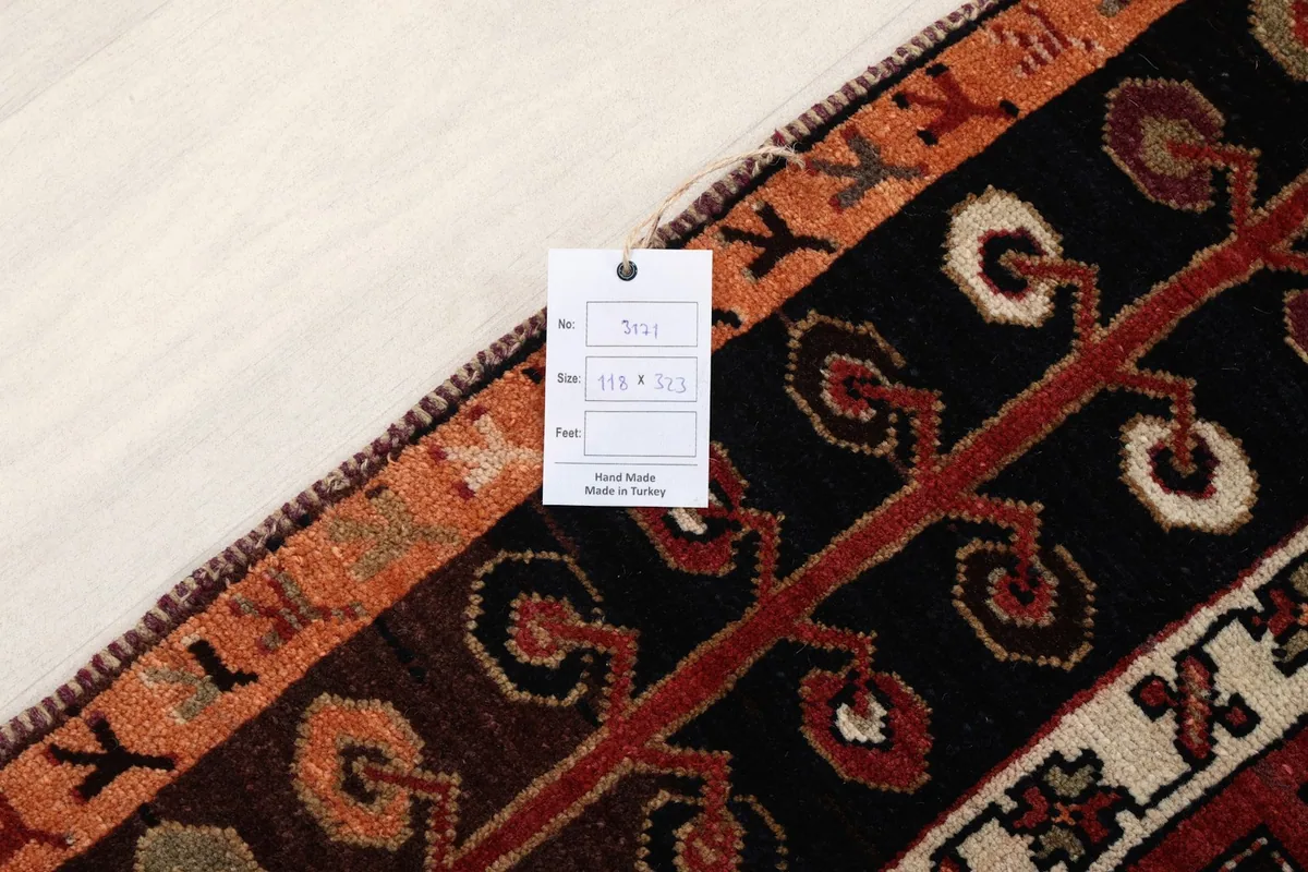Label on the back of the rug indicating its size, material, and origin from Turkey