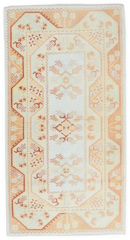 Full top view of the 4x6 ivory and orange geometric vintage Anatolian rug