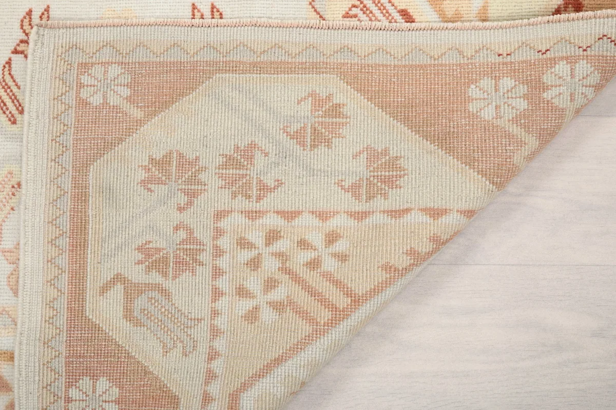 Another view of the rug's reverse side, revealing the hand-knotted construction
