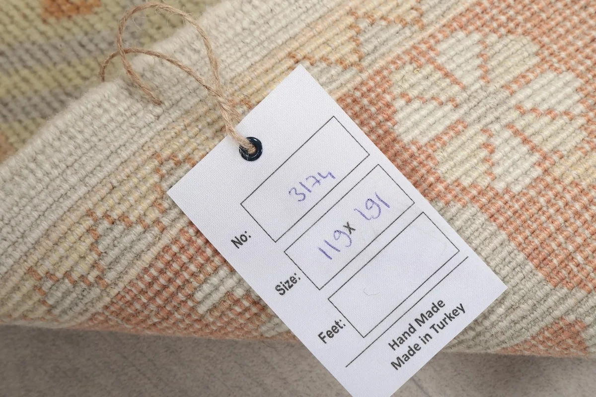 Product tag showing the rug's dimensions and origin, "Hand Made in Turkey"