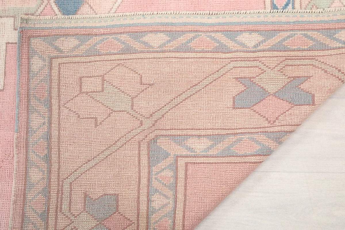 Close-up of the rug's edge, revealing the fringe and construction details.