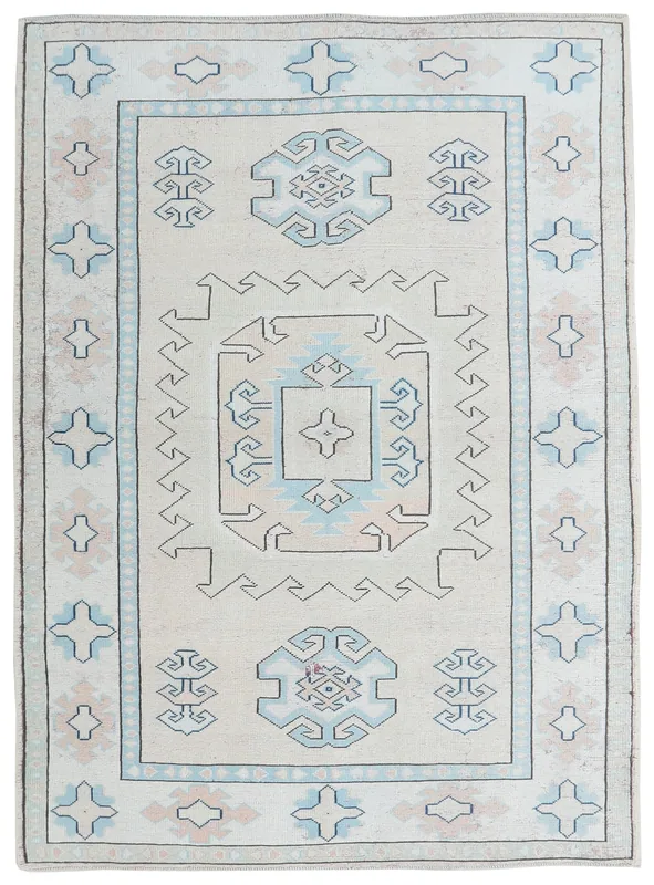 Full top view of the 6x8 ivory and blue geometric vintage Anatolian rug