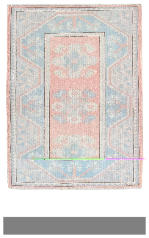 Full overhead view of the rose and blue vintage Anatolian rug