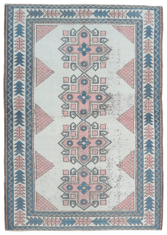 Full overhead view of the 4'2" x 6'3" ivory, pink, and blue vintage Anatolian rug