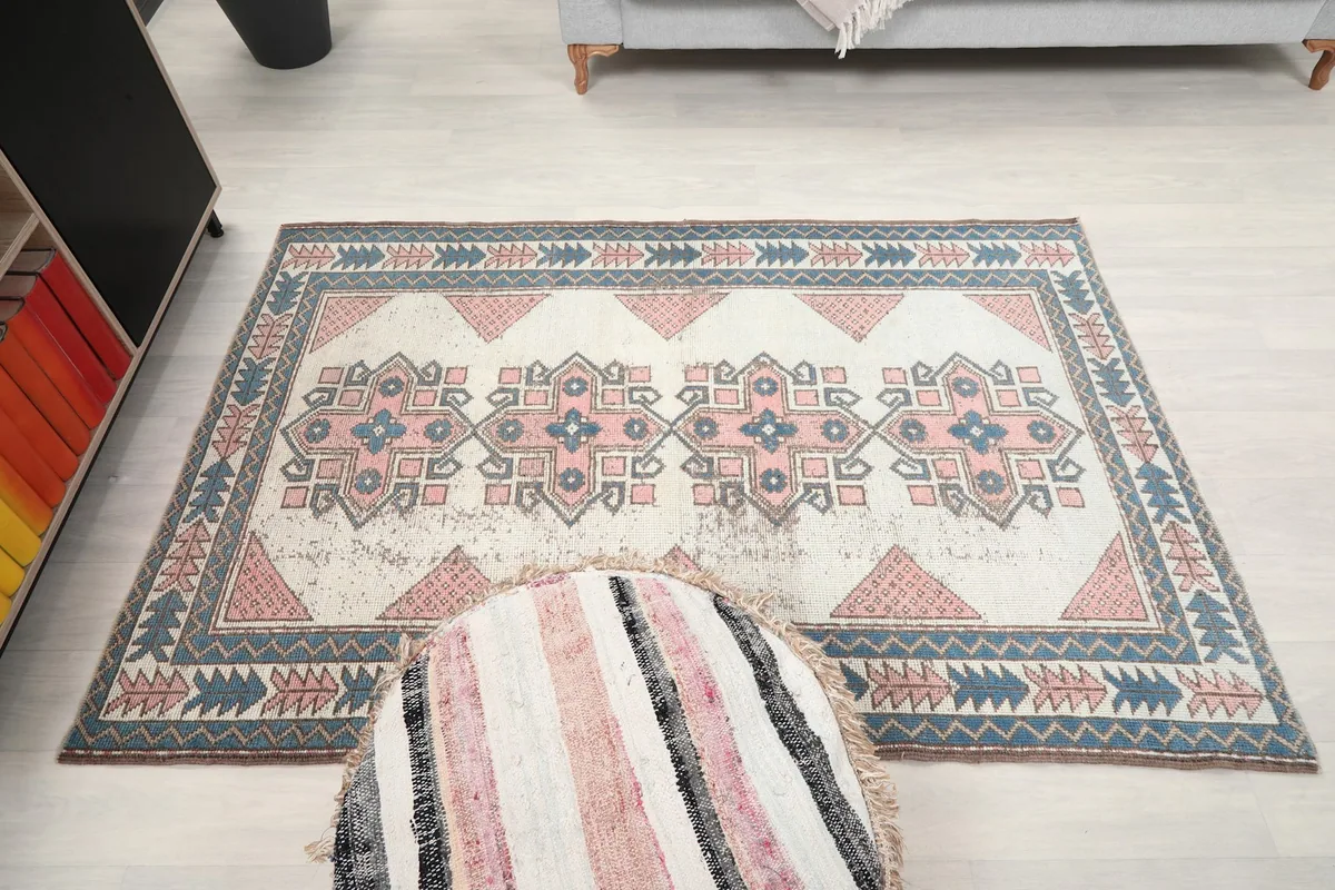 Full overhead shot of the rug on a light floor, showing its rectangular shape and overall design