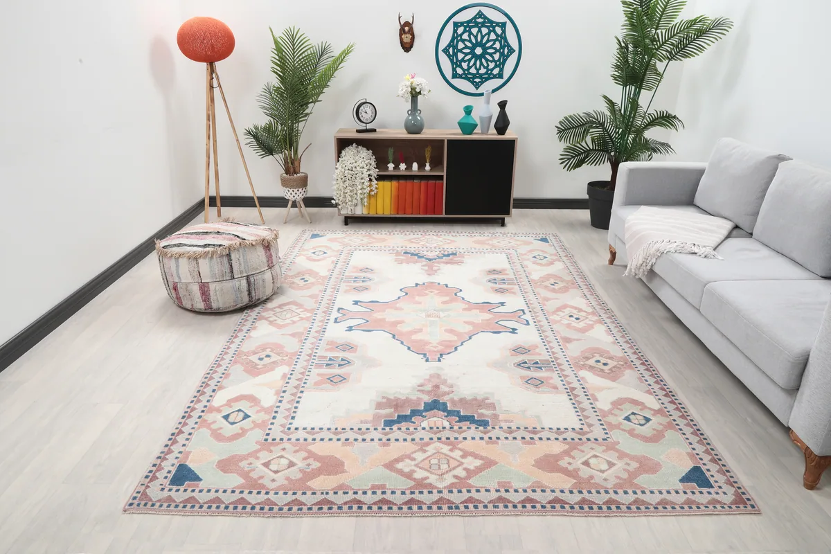 Ivory Rose Geometric Anatolian Rug in a living room setting, showing its scale and colors with furniture