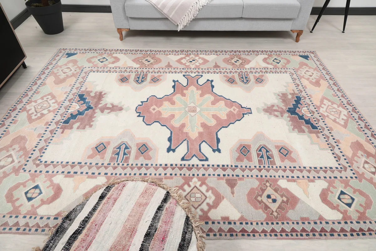 Full room view of the Ivory Rose Geometric Anatolian Rug, centered and showing its impact on the space