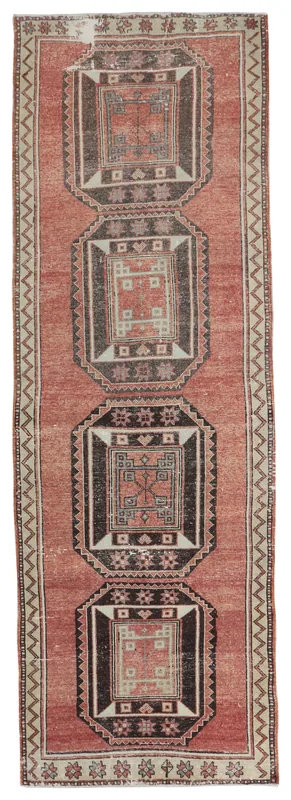 Full overhead view of the rust, black, and beige geometric Anatolian runner rug.
