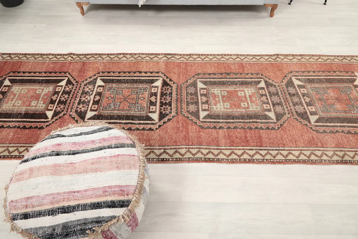 Top-down view of the runner rug placed in a room, showing its full length and pattern.