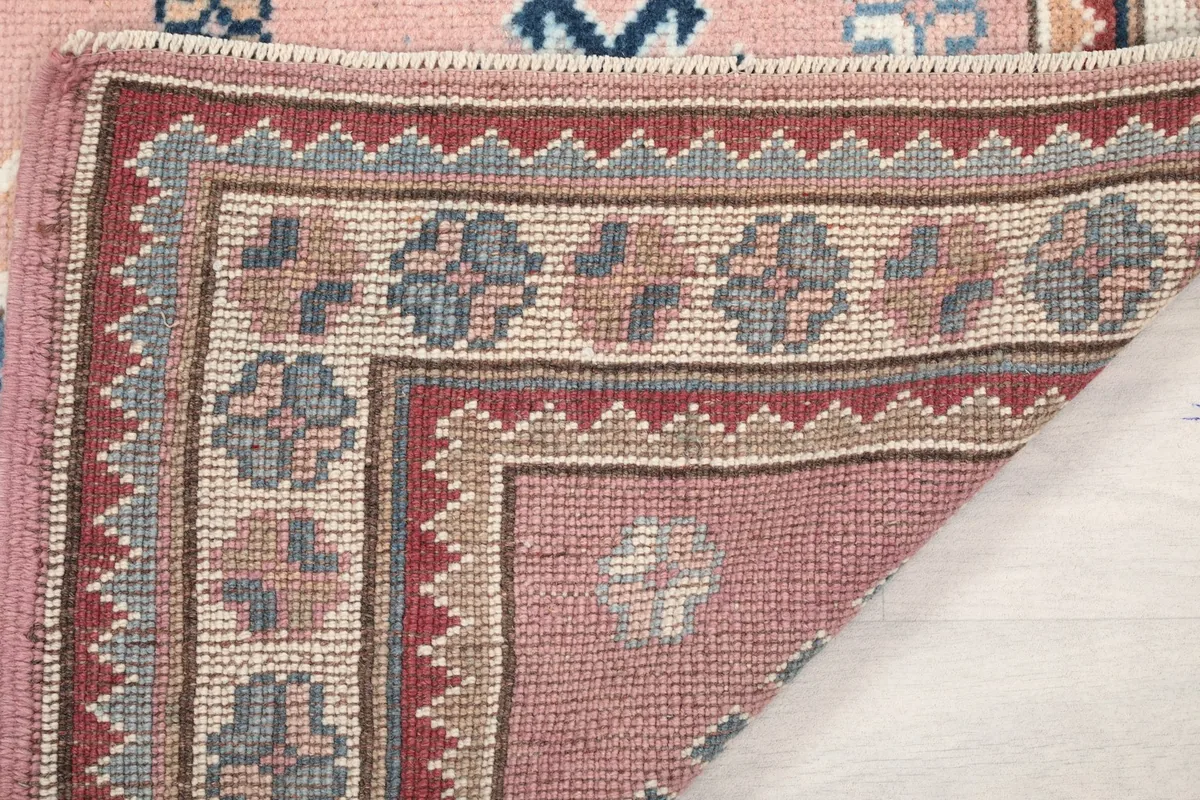 Underside view of the rug, showing the reverse side of the hand-knotted construction