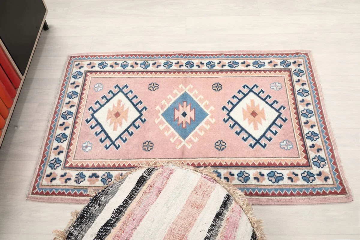 Overhead view of the rug on a light floor, emphasizing its full size and pattern layout