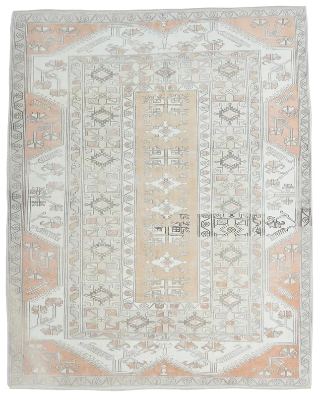 Full overhead view of the rose and ivory geometric vintage Anatolian rug