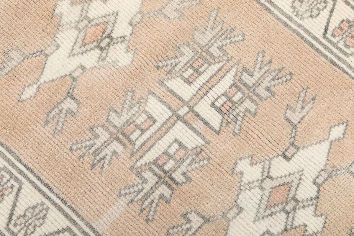 Close-up of the hand-knotted wool pile and intricate geometric design