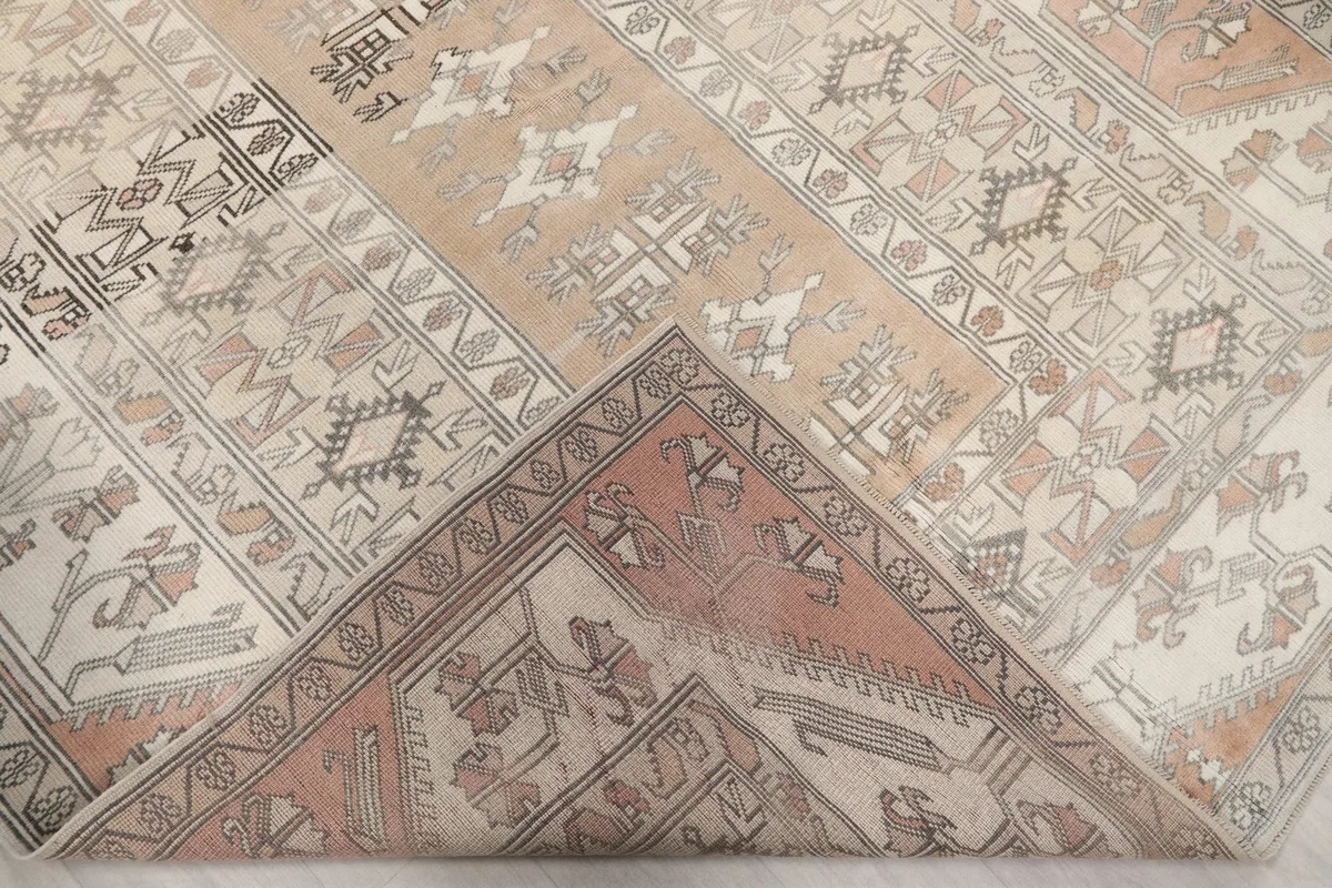 Underside of the hand-knotted rug, revealing the cotton foundation and knotting