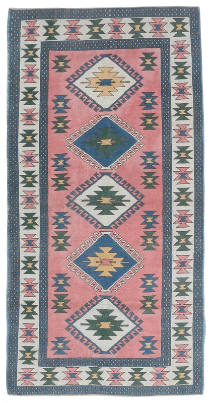 Top view of a 4'8" x 7'11" vintage Anatolian area rug with rose field and geometric patterns