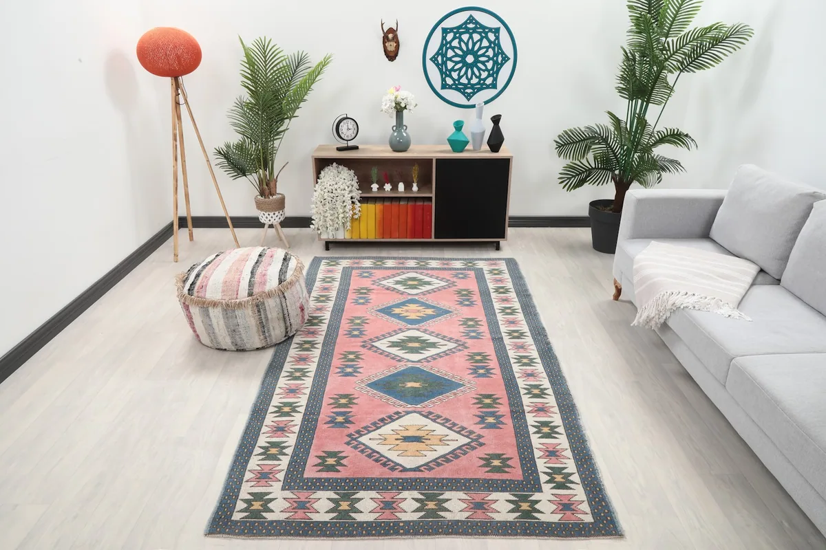 Vintage Anatolian rug in a modern living room setting, showcasing its full design and scale