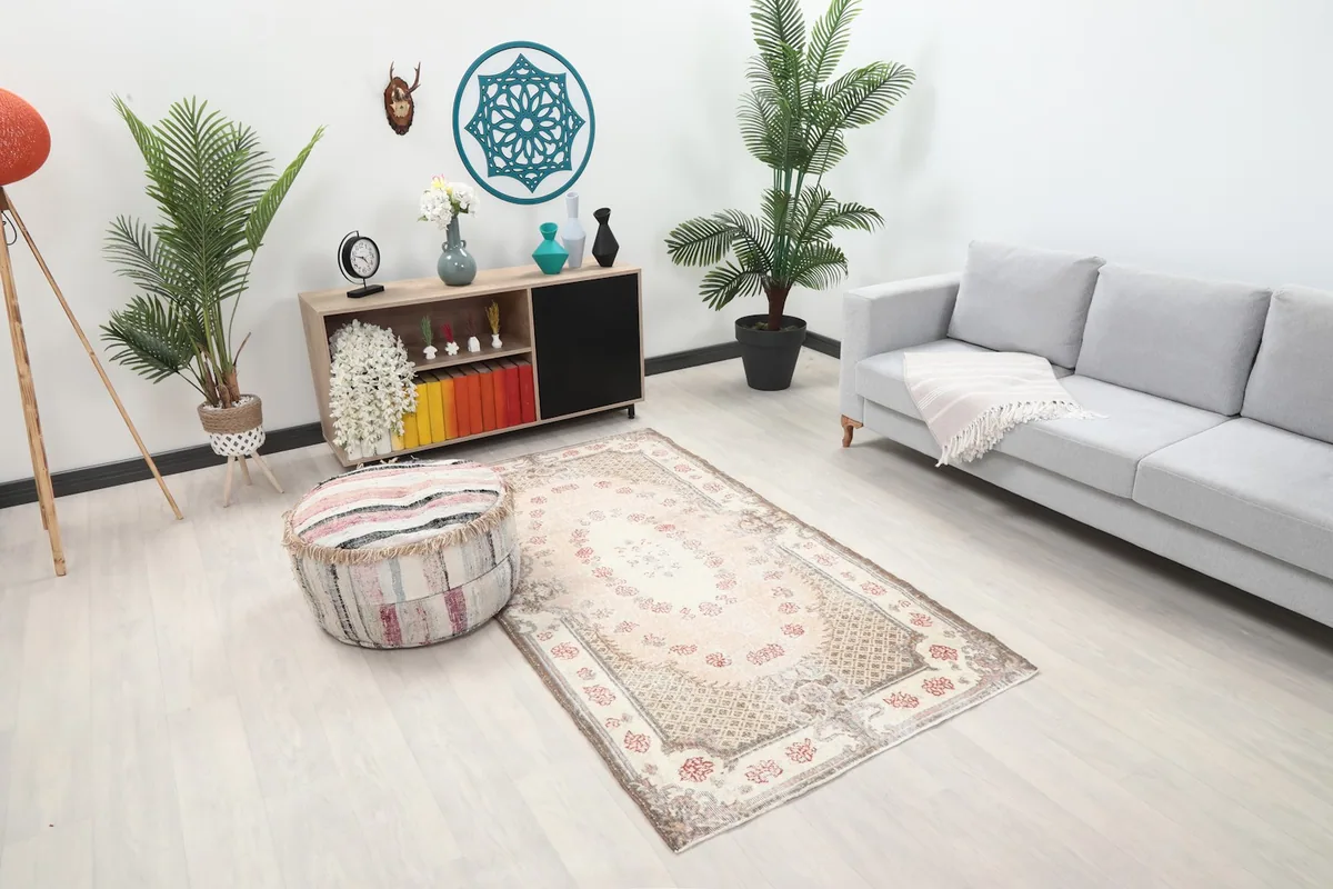 Overhead view of the vintage Anatolian rug in a room, showing its placement relative to furniture