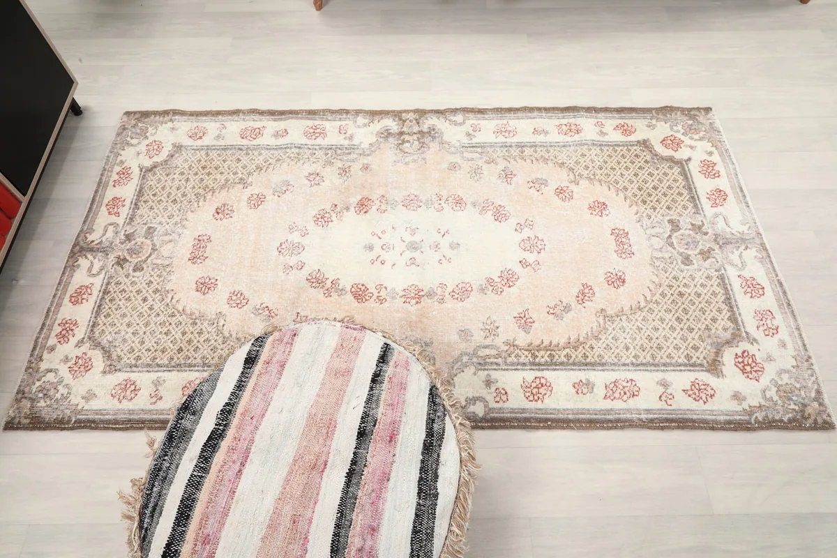 Direct overhead view of the rug on a light floor, emphasizing its full pattern