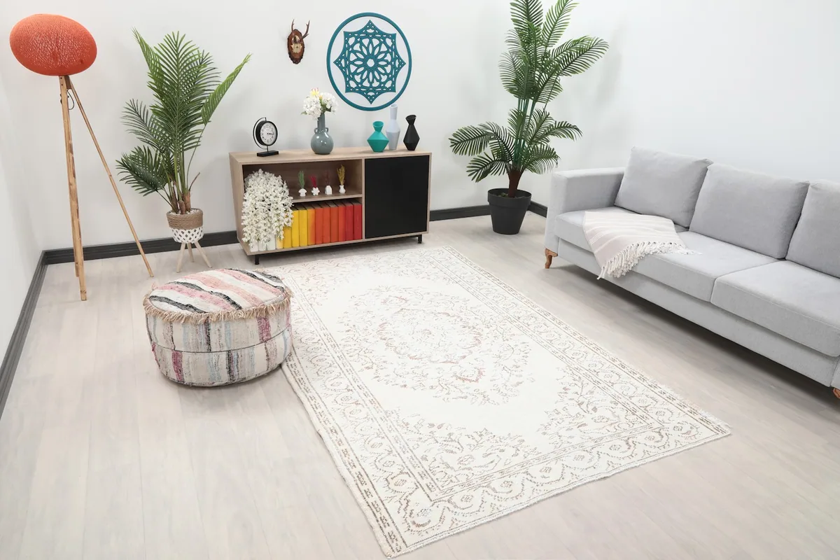 Angle view of the ivory area rug in a living room, highlighting its placement and room integration.