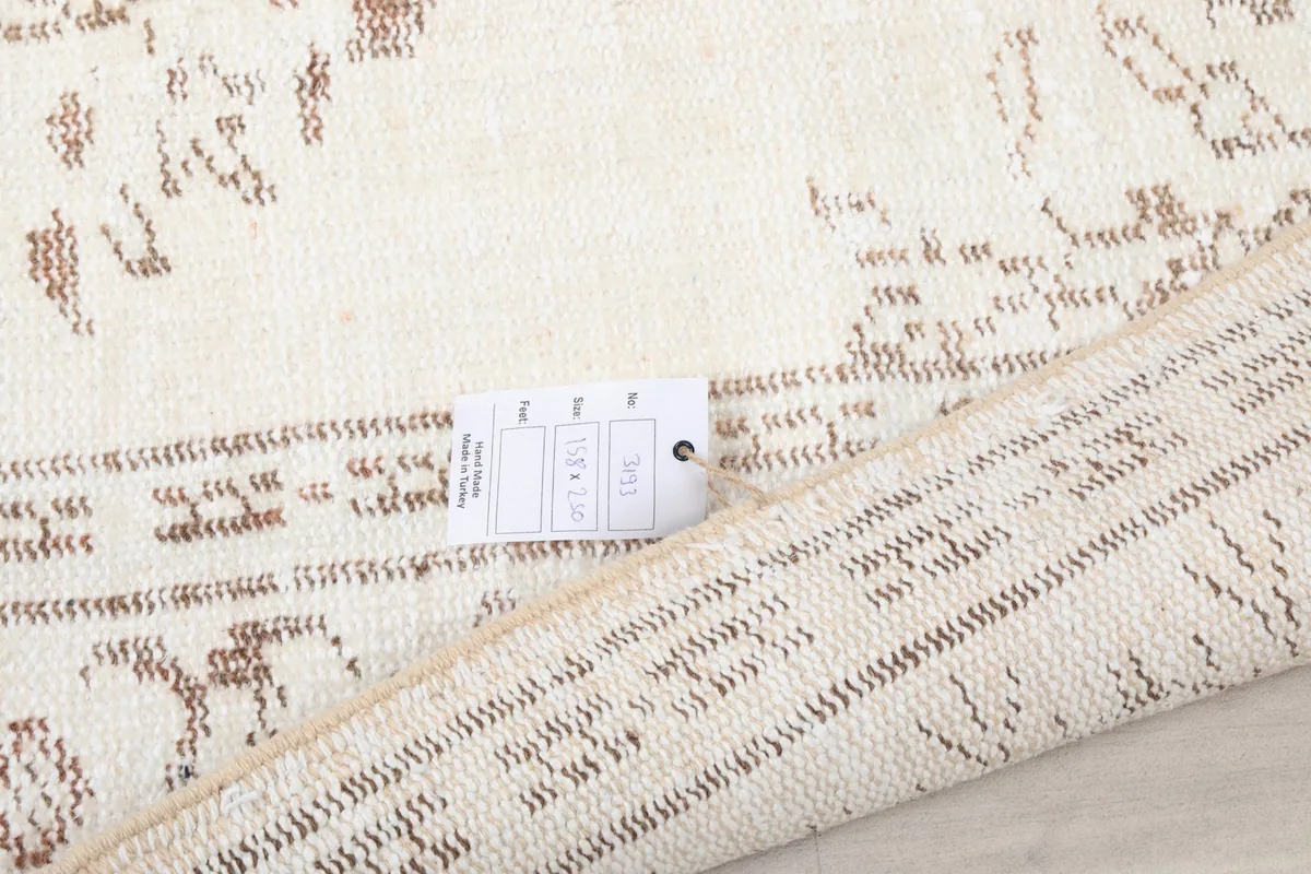 Close-up of the rug's edge with a product tag, indicating its origin and material details.