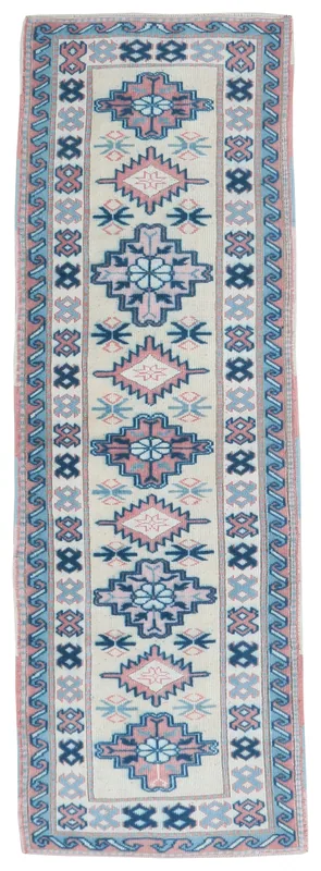 Full top view of the cream, rose, and blue geometric Anatolian runner rug