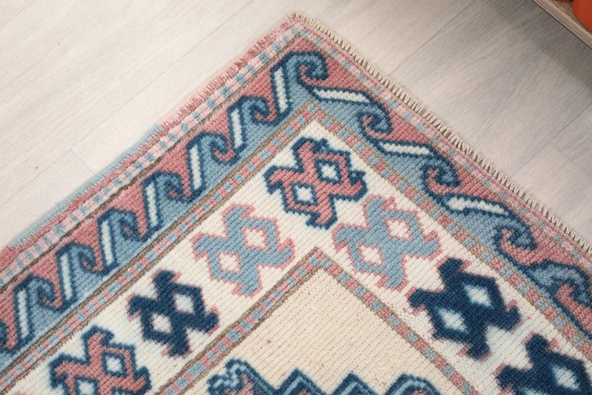 Detailed shot of the rug's border design and corner craftsmanship