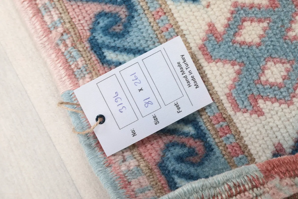 Product tag showing the size and origin information on the rug