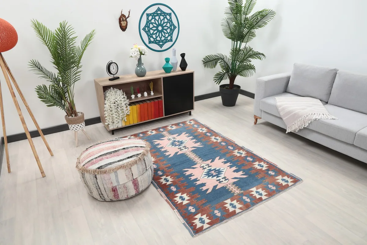 Angle room shot of the hand-knotted rug in a contemporary setting, highlighting its size and pattern.