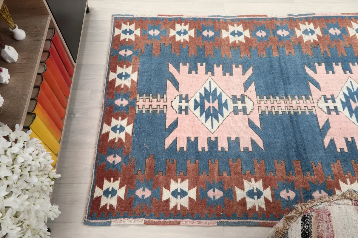 Overhead perspective of the rug, emphasizing its full pattern and color distribution in a home environment.