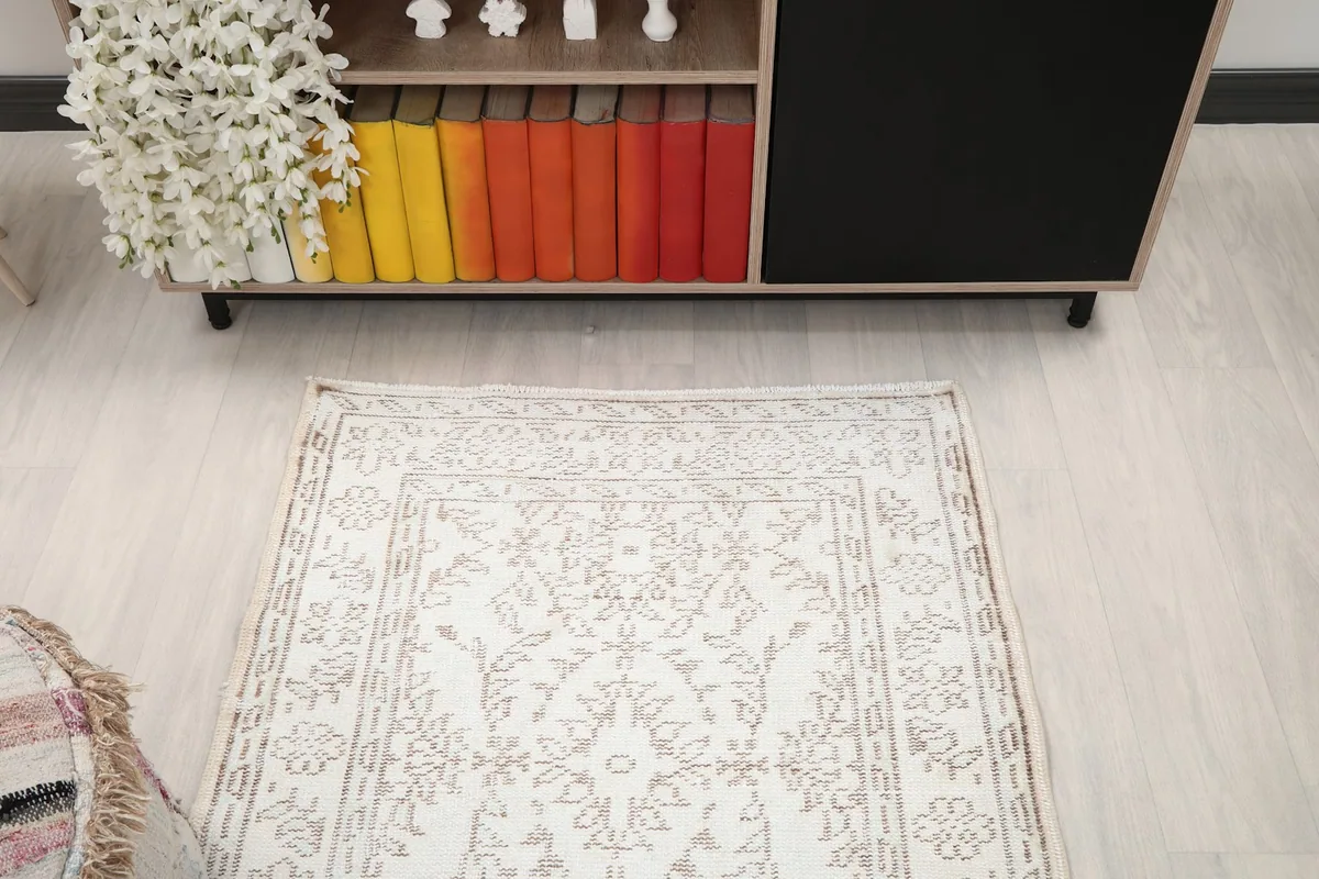 Overhead view of the rug in a room setting, showing its full length and design