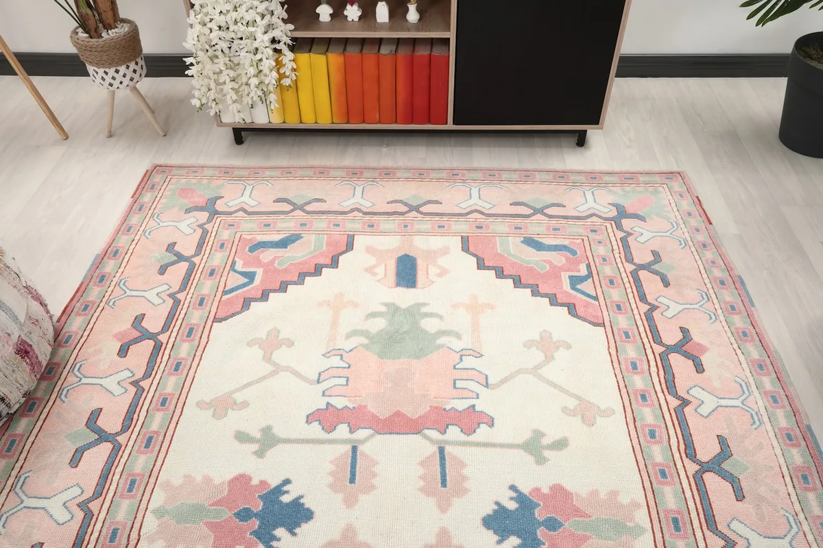 Overhead view of the rug in a room setting, showing its full design and colors