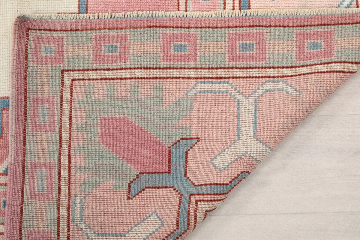 Another folded corner view, showing the reverse side of the hand-knotted construction