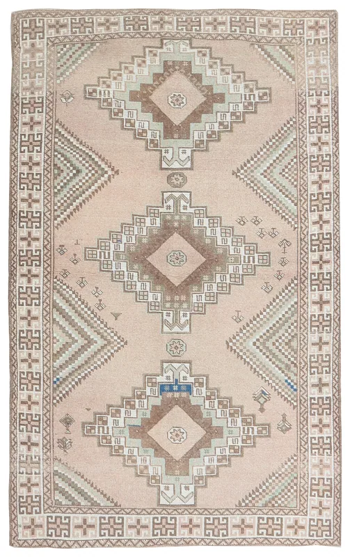 Full top view of a 4x6 vintage pink geometric tribal rug from Anatolia