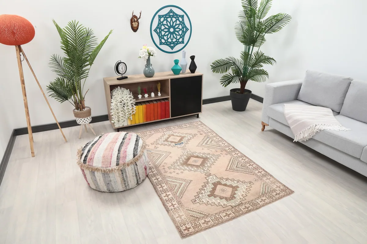 Overhead angle of the pink geometric rug placed in a light-filled living space