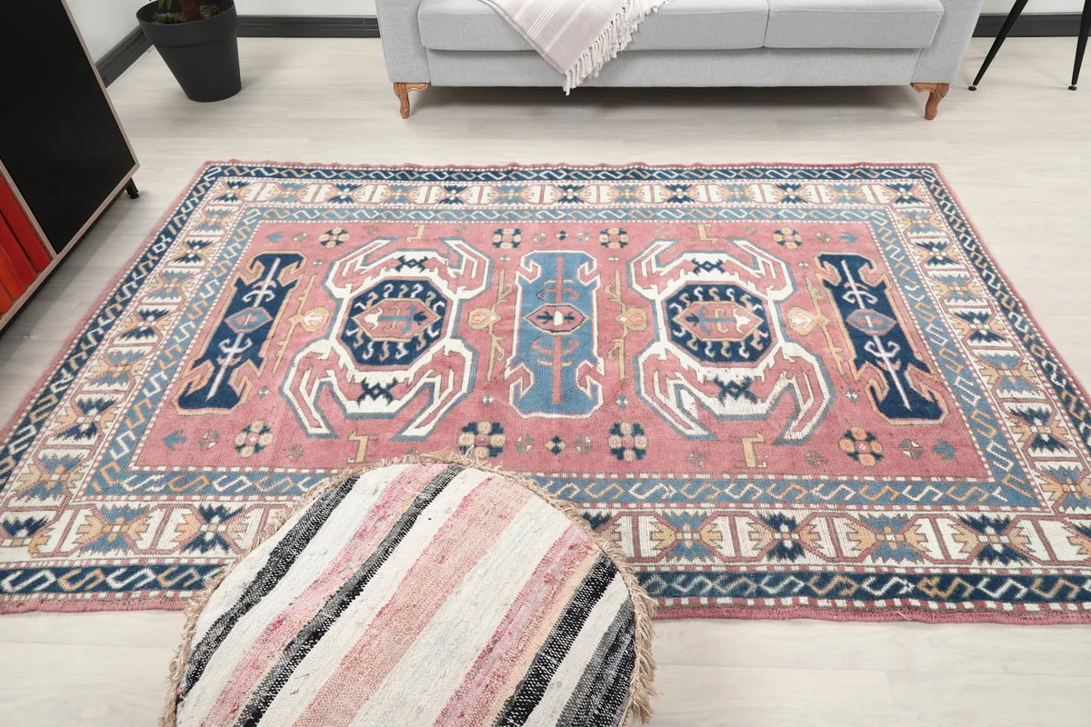 Wide angle view of the rug in a room, emphasizing its medium size and overall aesthetic