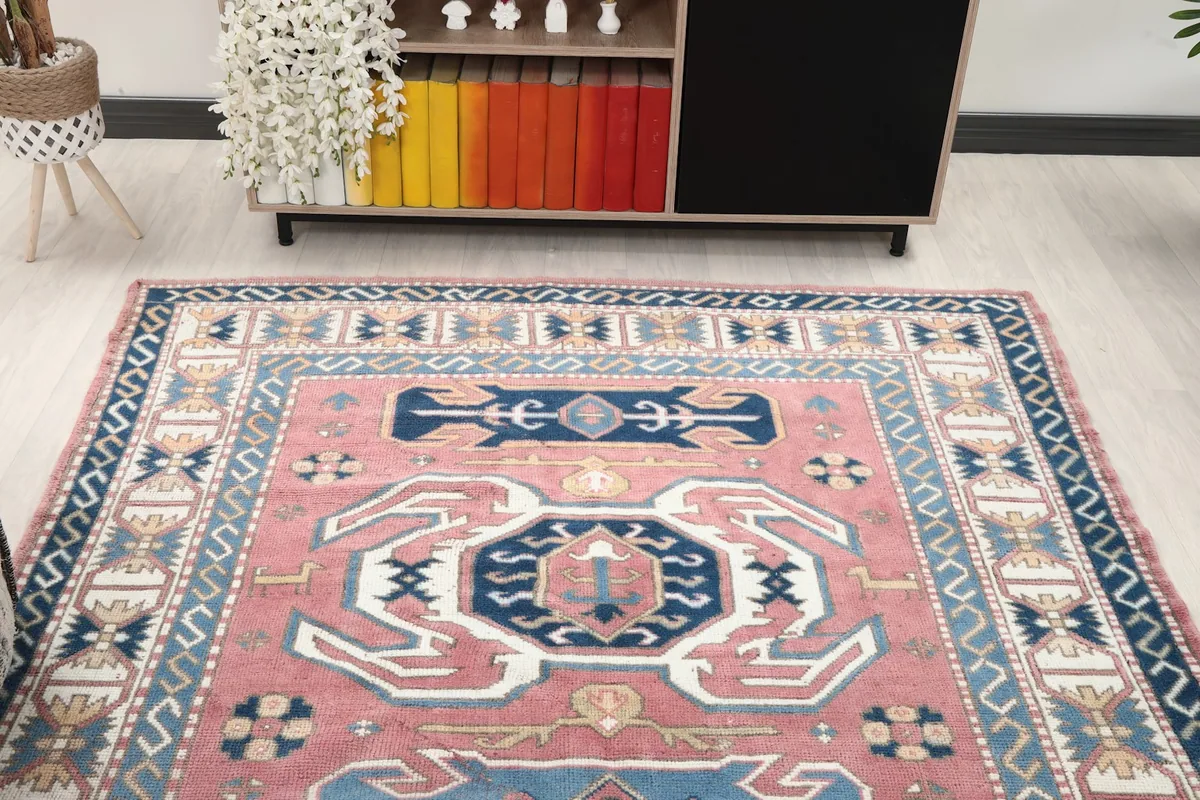 Straight overhead view of the vintage rug, showing its full length and patterns