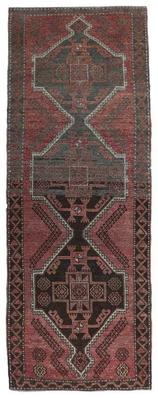 Full top view of the vintage Anatolian runner rug with rust and charcoal geometric patterns