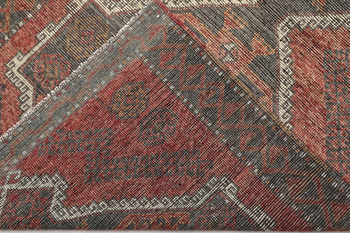 Folded section of the rug, revealing the back of the hand-knotted cotton foundation