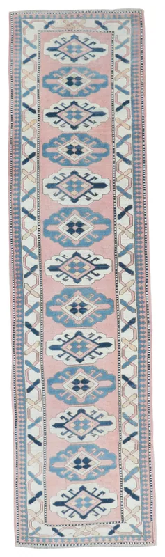 Full top view of the pink, blue, and navy geometric Anatolian runner