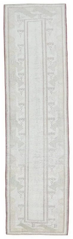 Full top view of the 2'4" x 9'5" cream and beige geometric runner rug on a white background.