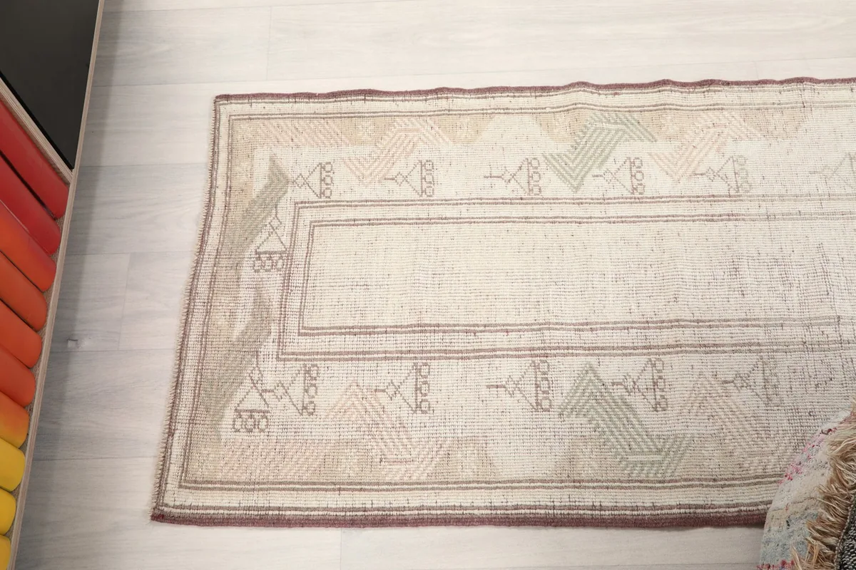 Overhead shot focusing on a section of the runner rug, capturing the full pattern width.